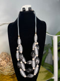 Gray cord necklace